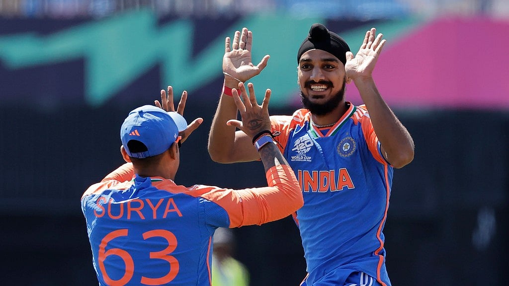 India's Arshdeep Singh, right, celebrates with teammate Suryakumar Yadav. - AP/Adam Hunger