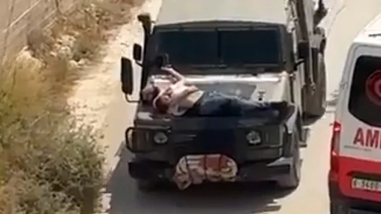 Israeli Army Straps Wounded Palestinian To Jeep | - X/Screengrab
