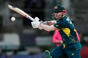 (AP Photo/Lynne Sladk : Australia's David Warner bats during the ICC Men's T20 World Cup cricket match between Australia and Bangladesh in North Sound, Antigua and Barbuda, Thursday, June 20, 2024.