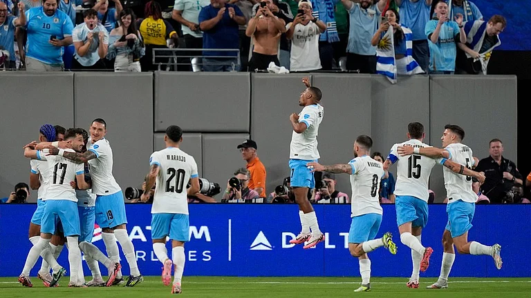 Uruguayan players celebrate a goal against Bolivia in their Copa America 2024 encounter. - AP/Julia Nikhinson