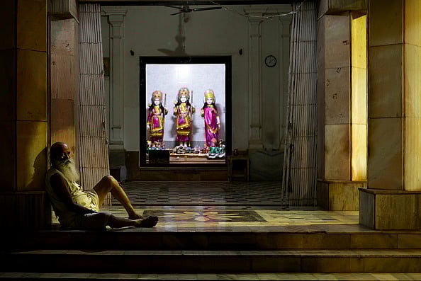 Getty Images : An ascetic, or Indian holy man, sits on a staircase of a temple near Ram Janambhoomi teerth, a construction hailed as a milestone achievement in Indian PM Modi’s tenure, on the eve of the Ram Navami festival in Ayodhya, Uttar Pradesh, India on 16 April 2024.