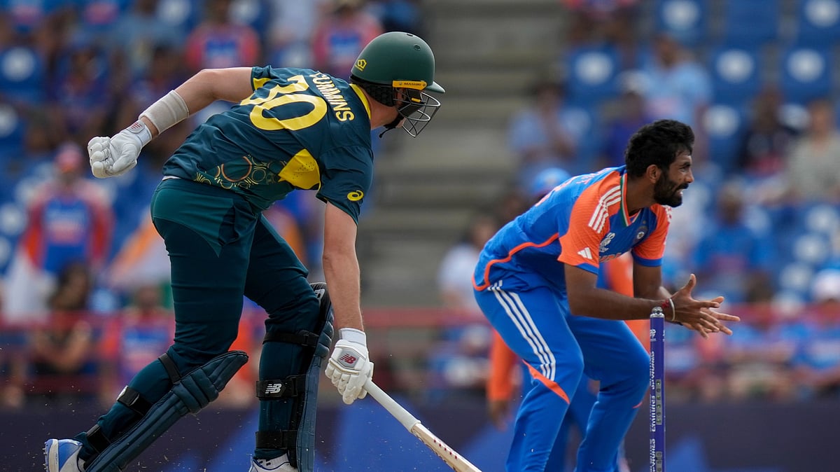 AP Photo/Ramon Espinosa : Australia's Pat Cummins scores runs during an ICC Men's T20 World Cup cricket match against India at Darren Sammy National Cricket Stadium in Gros Islet, Saint Lucia.