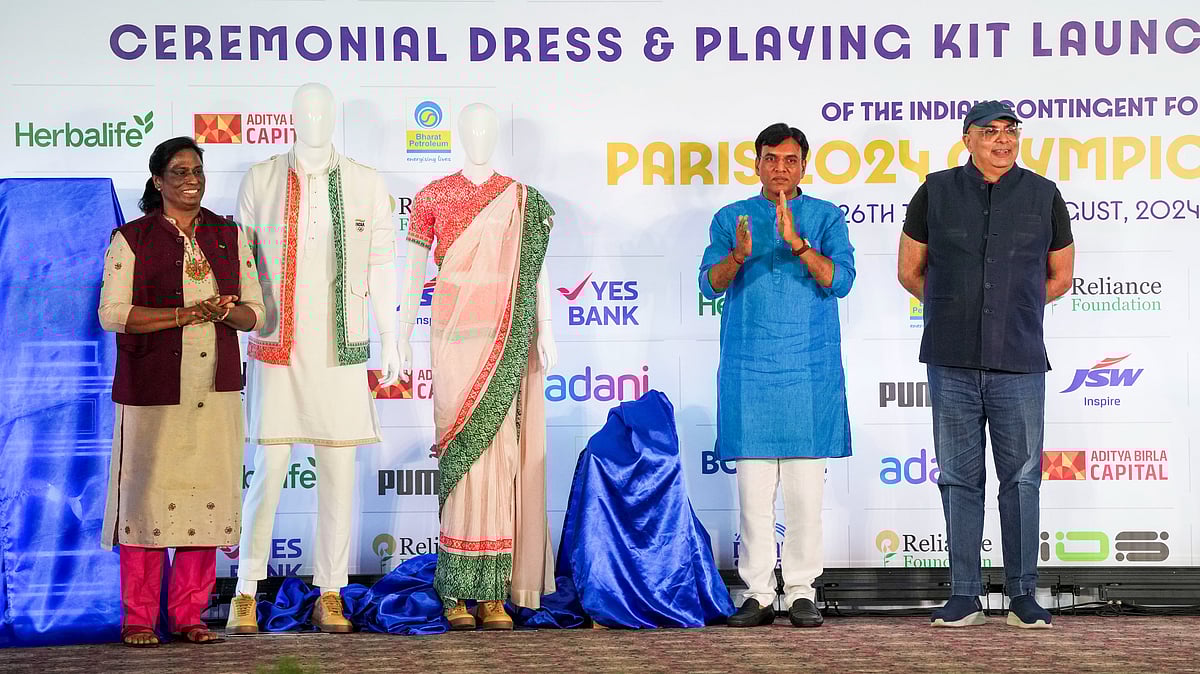 PTI Photo/Arun Sharma : Union Minister of Youth Affairs and Sports Mansukh Mandaviya and IOA Chief PT Usha during the launch of the ceremonial dress and playing kit for the upcoming Paris Olympics.