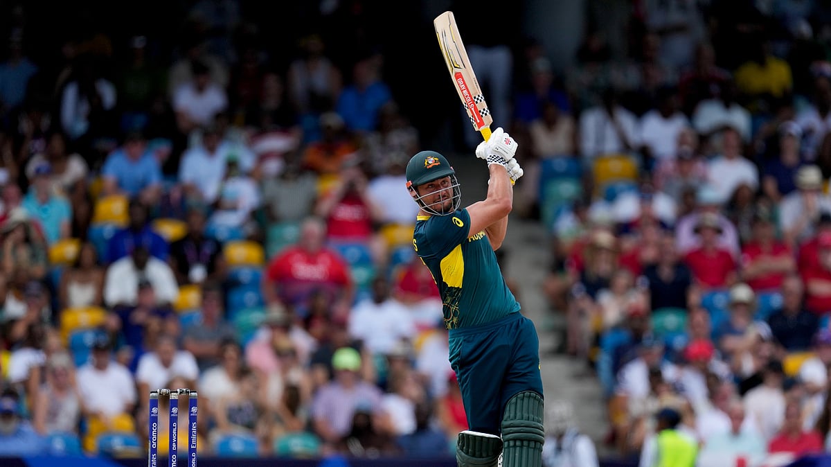 AP Photo/Ricardo Mazalan : Australia's Marcus Stoinis hits a four against England during an ICC Men's T20 World Cup cricket match at Kensington Oval in Bridgetown, Barbados.