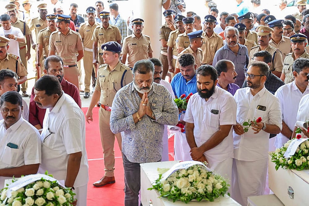 | Photo: PTI : Suresh Gopi pays respect to the mortal remains of Kuwait fire victims