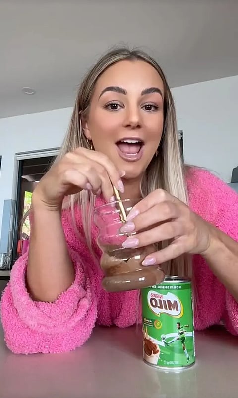 Karina Irby demostrates how to prepare Milo drink in her.