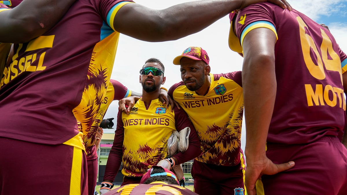 West Indies' Roston Chase, right, gathers with teammates prior to their during an ICC Men's T20 World Cup cricket match against Papua New Guinea at Guyana National Stadium in Providence, Guyana, Sunday, June 2, 2024. 

 - (AP Photo/Ramon Espinosa)
