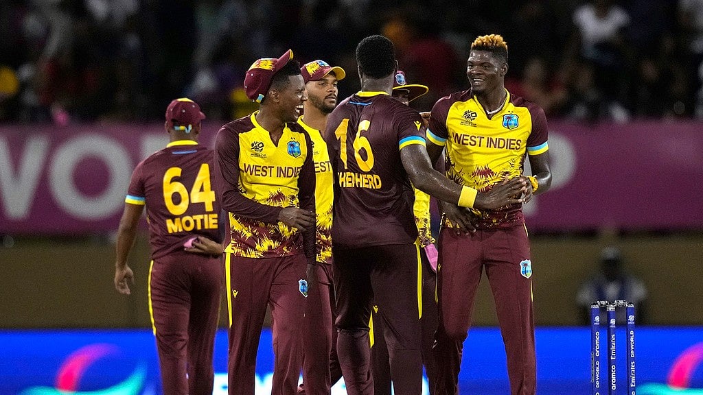 West Indies players listen to their national anthem before an ICC Men's T20 World Cup cricket match against Uganda at Guyana National Stadium in Providence, Guyana, Saturday, June 8, 2024. 
 - (AP Photo/Ramon Espinosa)