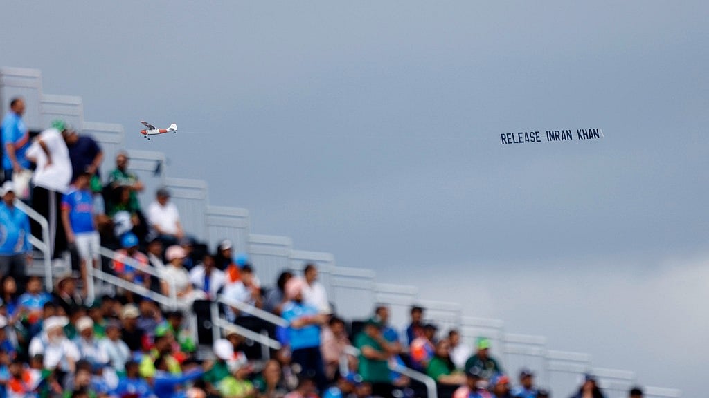 An aircraft tows a banner which reads "Release Imran Khan" as it flies over the venue of the ICC Men's T20 World Cup cricket match between India and Pakistan at the Nassau County International Cricket Stadium in Westbury, New York, Sunday, June 9, 2024. - AP Photo/Eduardo Munoz