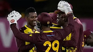 AP/Ramon Espinosa : West Indies players celebrate during their T20 World Cup 2024 match against Uganda.