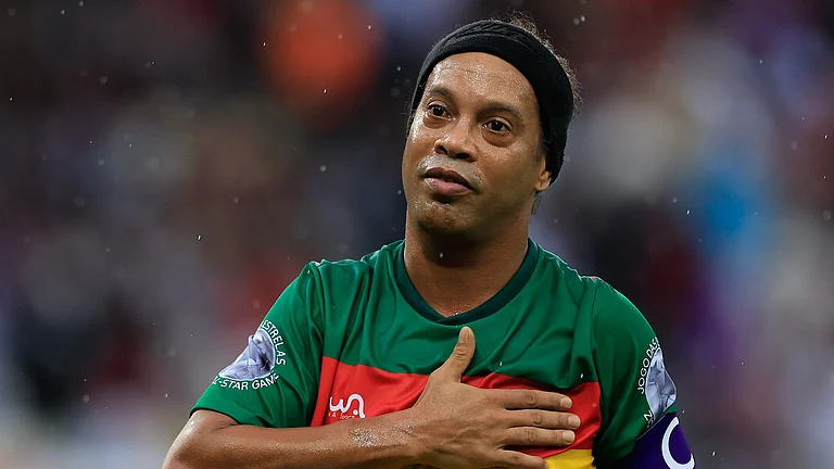 Ronaldinho pictured playing in a charity match last month - null