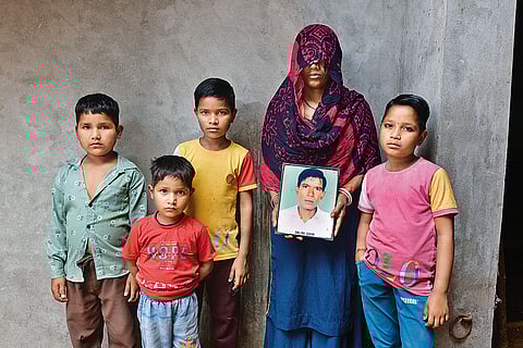 High Hopes: Sonu, who was arrested along with Azad in 2017, died by suicide in 2019. Seen in the picture
is his widow Rachana, along with their children