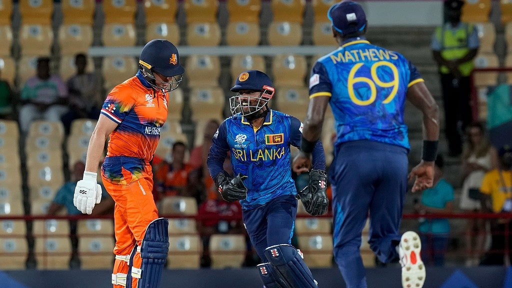 Photo: AP/Ramon Espinosa : Sri Lanka's Kusal Mendis, centre, celebrates the dismissal of Logan van Beek of the Netherlands, left, during their ICC T20 World Cup 2024 clash at the Daren Sammy National Cricket Stadium in Gros Islet, Saint Lucia on June 17.