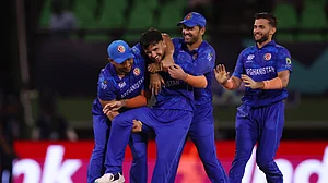 Photo: X/Afghanistan Cricket : Afghanistan seamer Fazalhaq Farooqi (second from left) picked up four wickets for 17 runs against New Zealand in their T20 World Cup 2024 match in Guyana.