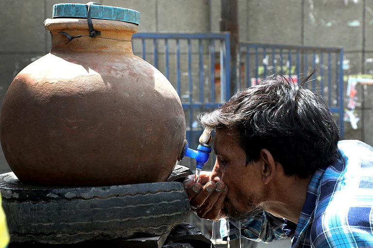 A Man Drinking water in Summer - SURESH K PANDEY