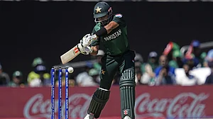 AP Photo/Tony Gutierrez : Pakistan's captain Babar Azam plays a shot during the ICC Men's T20 World Cup cricket match between United States and Pakistan at the Grand Prairie Stadium in Grand Prairie, Texas, Thursday, June 6, 2024.