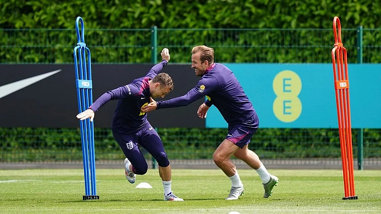 England's Harry Kane, right, and Kieran Trippier duringa training session at the Tottenham Hotspur Training Session, London, Thursday June 6, 2024. - (Zac Goodwin/PA via AP)