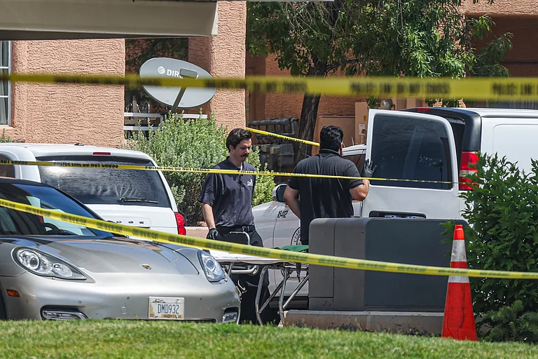 North Las Vegas Police investigate the scene of Monday night's shooting at an apartment complex in North Las Vegas, Tuesday, June 25 - AP