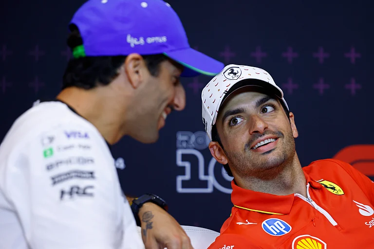 Ferrari driver Carlos Sainz of Spain, right, speaks with RB team driver Daniel Ricciado of Australia during a press conference at the Barcelona Catalunya racetrack in Montmelo, near Barcelona, Spain, Thursday June 20, 2024. The Spanish Grand Prix Formula One race will be held on Sunday.
 -  (AP Photo/Joan Monfort)