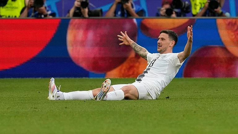 Slovenia's Erik Janza celebrates scoring a goal - | Photo: AP/Antonio Calanni