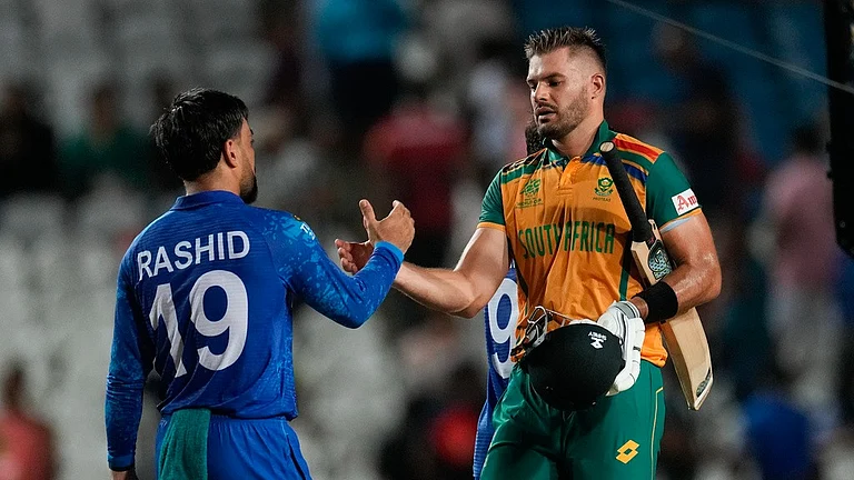 Captains Rashid Khan and Aiden Markram shake hands after South Africa beat Afghanistan by nine wickets in the first semi-final of ICC T20 World Cup 2024, in Trinidad on Thursday (June 27). - AP/Ricardo Mazalan