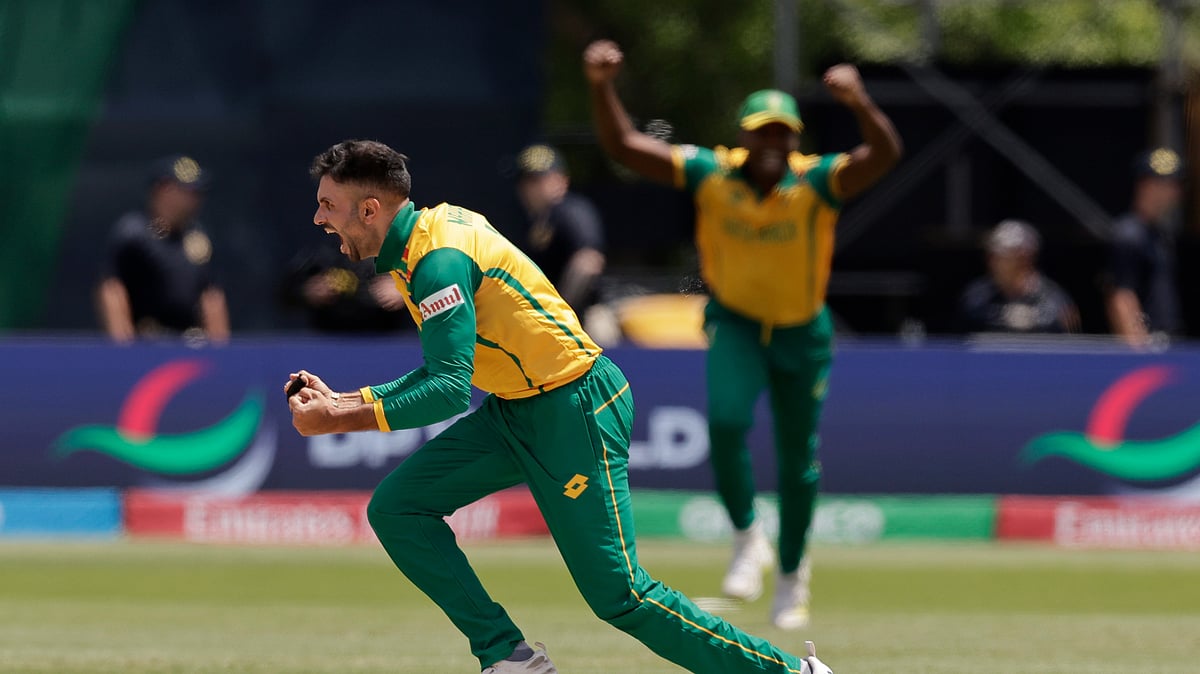Photo: AP/PTI : South Africa's Keshav Maharaj celebrates the dismissal of Bangladesh's Mahmudullah Riyad during the ICC Men's T20 World Cup cricket match between Bangladesh and South Africa at the Nassau County International Cricket Stadium in Westbury, New York.