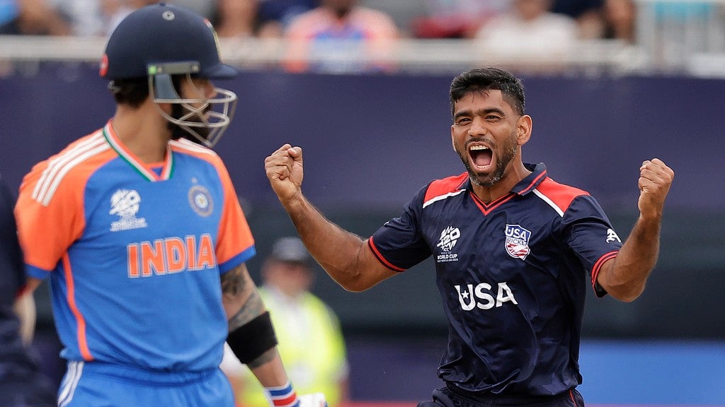 United States' Saurabh Nethralvakar, right, celebrates the dismissal of India's Virat Kohli, left, during the ICC Men's T20 World Cup cricket match between United States and India at the Nassau County International Cricket Stadium in Westbury, New York, Wednesday, June 12, 2024. - AP/Adam Hunger
