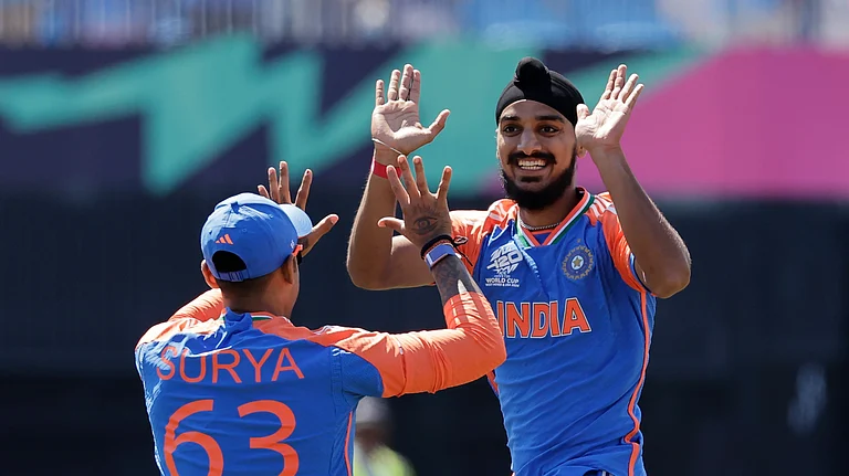 India's Arshdeep Singh, right, celebrates with teammate Suryakumar Yadav after the dismissal of United States Shayan Jahangir during the ICC Men's T20 World Cup cricket match between the United States and India at the Nassau County International Cricket Stadium in Westbury, New York. - AP Photo/Adam Hunger