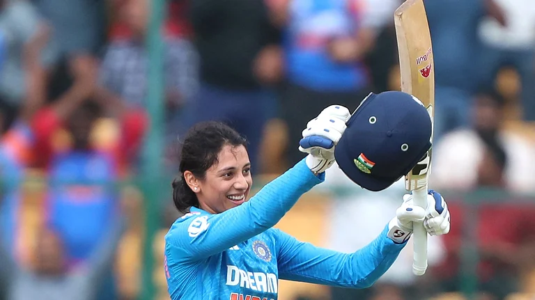 Smriti Mandhana celebrates her century against SA-W. - X/@BCCIWomen