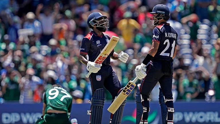 Pakistan's Haris Rauf, left, on the ground, reacts as United States' Aaron Jones and Nitish Kumar, right, celebrate during the ICC Men's T20 World Cup cricket match between the United States and Pakistan at the Grand Prairie Stadium in Texas. - Photo: AP/PTI