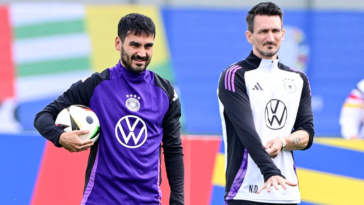 Gundogan (L) cannot wait to lead Germany out on Friday