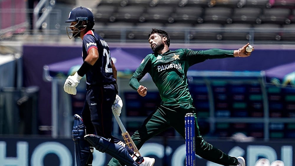 | Photo: AP/Tony Gutierrez : Pakistan's Mohammad Amir bowls against USA.