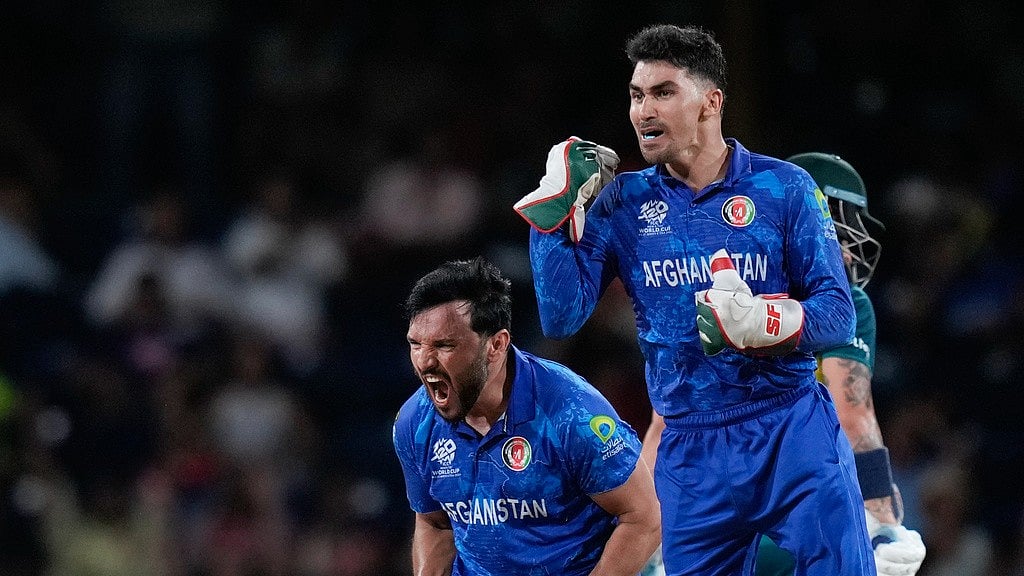 AP/Ramon Espinosa : Afghanistan celebrate their victory over Australia in their ICC T20 World Cup 2024, Super Eights match in St Vincent.