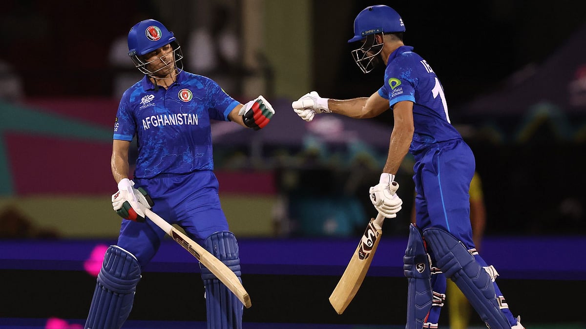 Gurbaz and Zadran congratulate each other. - null