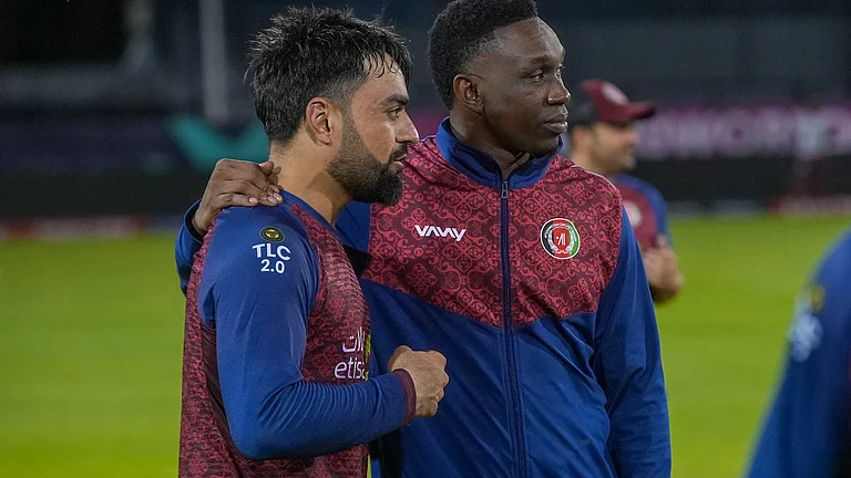 Rashid Khan, the Afghanistan skipper, with coach Dwayne Bravo - X/@ACB Media