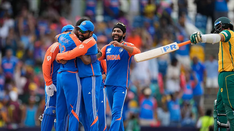 Indias Hardik Pandya, second left, celebrates with teammates after their win against South Africa in the ICC Mens T20 World Cup final. AP Photo