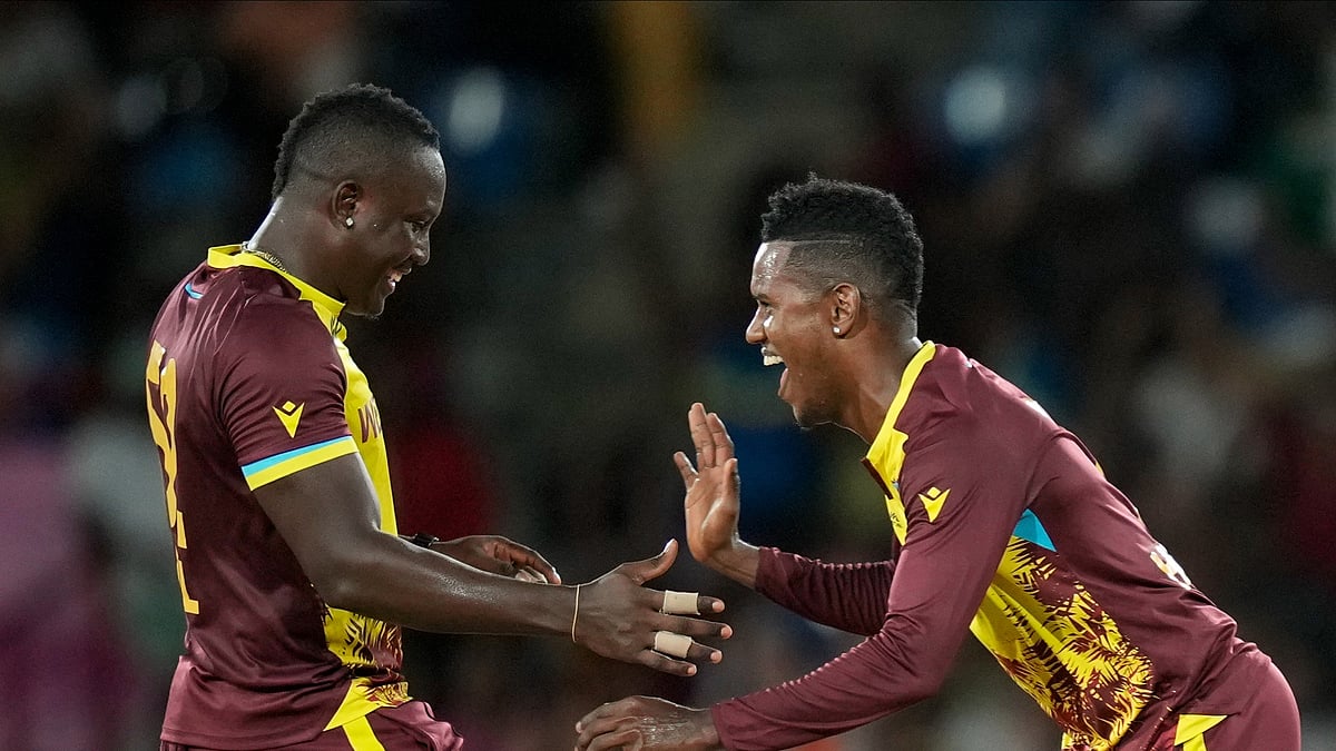 Rovman Powell and Akeal Hosein celebrating after the win against Afghanistan. AP