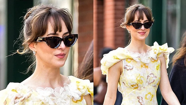 The actor stepped out in a floaty yellow sundress while filming in New York City.  - Twitter