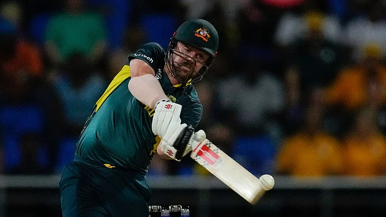 Travis Head bats during the Australia vs Namibia match at ICC T20 World Cup 2024 in Antigua.  - Photo: AP/Ricardo Mazalan