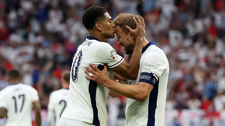 Harry Kane and Jude Bellingham celebrate on Sunday against Slovakia. - null