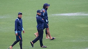 Photo: AP/Lynne Sladky : Nepal players walk around in the wet outfield after rain delays play at their match against Sri Lanka in the ICC T20 World Cup 2024, match 23 in Florida.