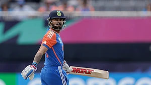 (AP Photo/Adam Hunger) : India's opening batsman Virat Kohli walks off the pitch after being dismissed for one run during an ICC Men's T20 World Cup cricket match against Ireland at the Nassau County International Cricket Stadium in Westbury, New York, Wednesday, June 5, 2024.