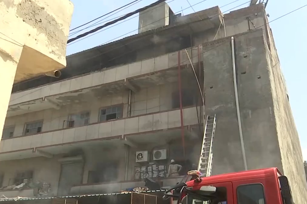 X/@ANI : Fire tenders at Mundka Industrial Area's factory.