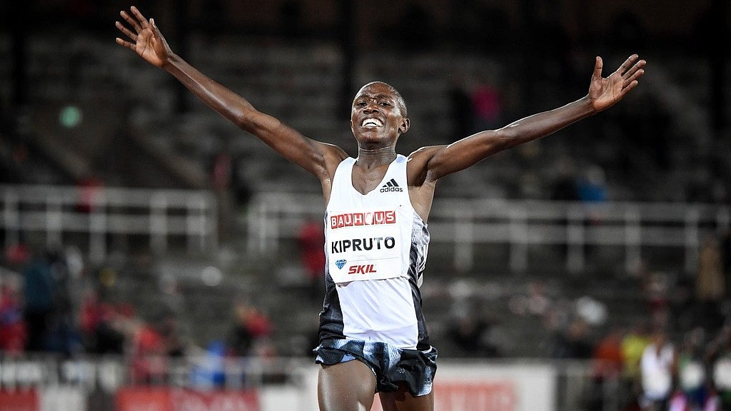 File/AP : Rhonex Kipruto of Kenya reacts after crossing the finish line to win the men's 10,000m race at the IAAF Diamond League meeting at Stockholm Olympic Stadium in Stockholm, Sweden, Thursday, May 30, 2019. Kenyan runner Rhonex Kipruto has been stripped of his world record in men's 10-kilometer road racing and banned for six years in a doping case. 