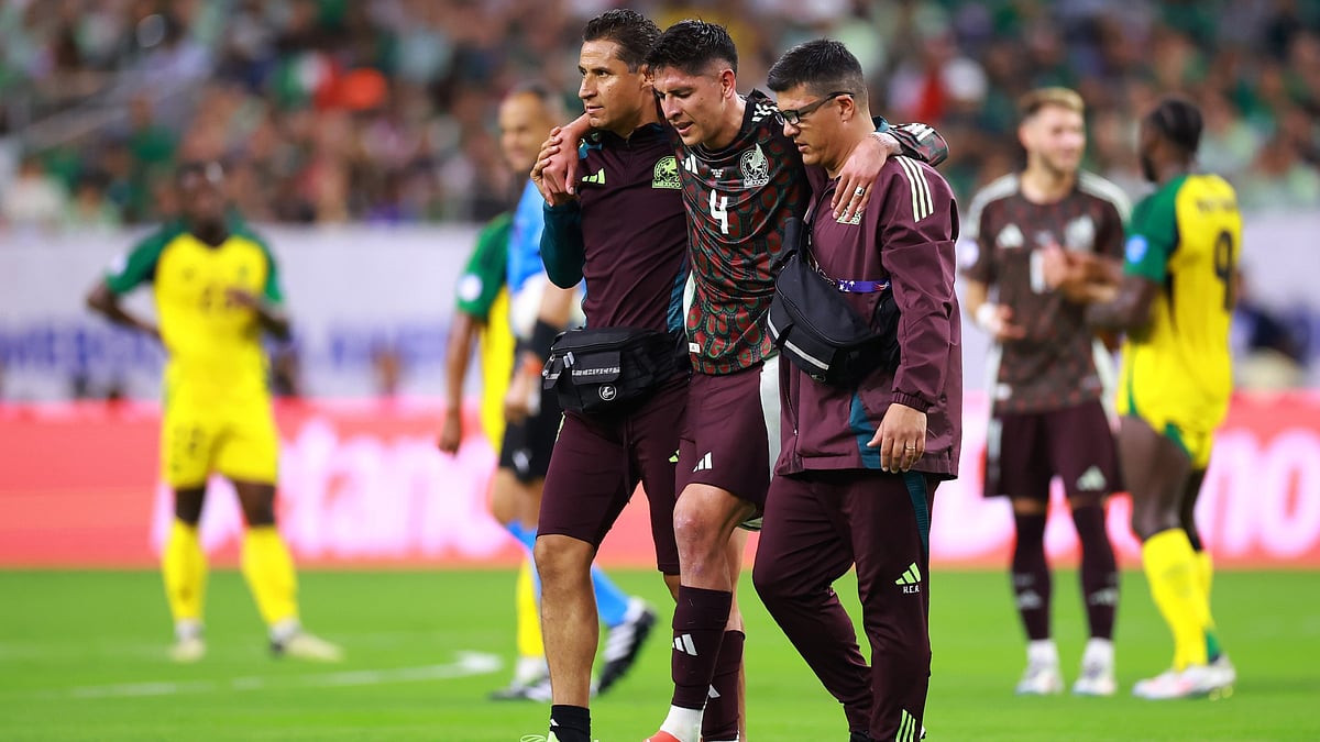 Edson Alvarez is helped from the pitch during Mexico's opening Copa America game. - null