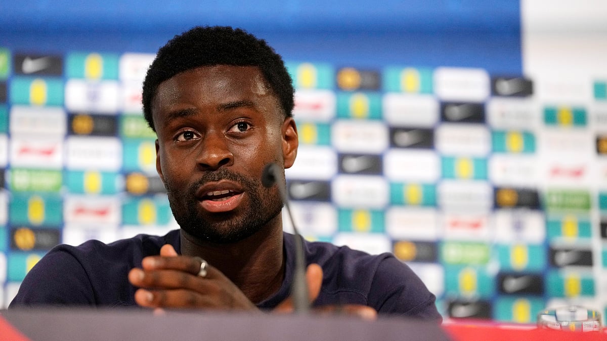 AP Photo/Thanassis Stavrakis : England's Marc Guehi speaks during a press conference in Blankenhain, Germany, Thursday, June 27, 2024, ahead of the national team round of 16 soccer match against Slovakia at the Euro 2024 football tournament.