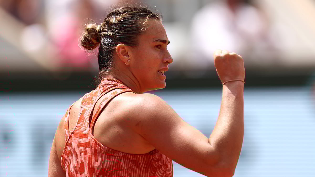 Aryna Sabalenka celebrates after winning match point. - null