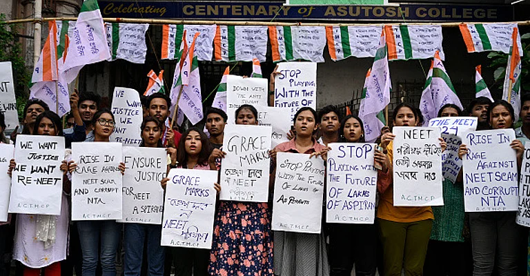 Trinamool Chhatra Parishad (TMCP), students wing of All India Trinamool Congress (TMC) supporters staged a protest against recent scam in NEET and UGC-NET exam in front of Asutosh College, on June 22, 2024 in Kolkata, India. - (Photo by Samir Jana via Getty Images)