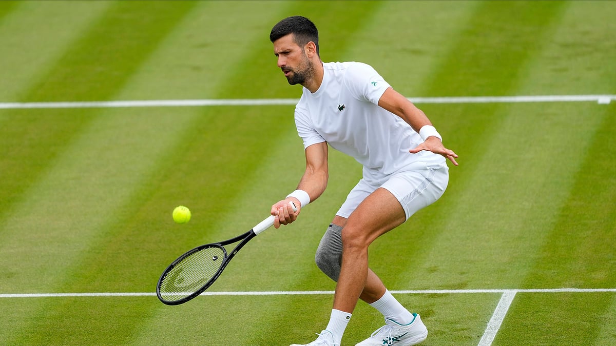 (AP Photo/Kirsty Wigglesworth) : Novak Djokovic of Serbia plays a return during a training session on Court 2 at the All England Lawn Tennis and Croquet Club in Wimbledon, London, Friday, June 28, 2024. The Wimbledon Championships begin on July 1.