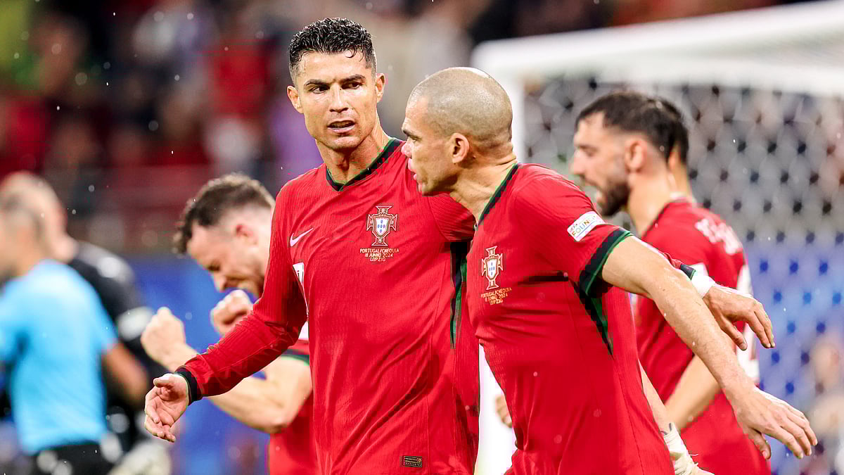 Veteran campaigners Pepe and Cristiano Ronaldo discuss after Francisco Conceicao's late winner for Portugal on Tuesday. - null